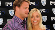 July 29, 2010; Los Angeles, CA, USA; USC Trojans coach Lane Kiffin (left) and wife Layla Kiffin (right) at the Fox Sports Pac-10 Conference Hollywood Premiere Night at the 20th Century Fox studios.