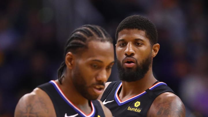 Feb 26, 2020; Phoenix, Arizona, USA; Los Angeles Clippers guard Paul George (right) and forward Kawhi Leonard against the Phoenix Suns at Talking Stick Resort Arena. Mandatory Credit: Mark J. Rebilas-USA TODAY Sports