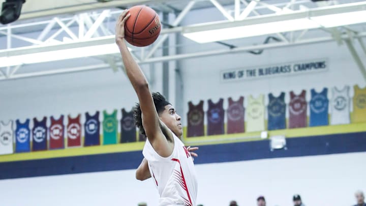 Newport's Taylen Kinney (0) goes up for two of his 13 points in the first half against Washington County at Wednesday's 2023 King of the Bluegrass basketball tournament at Fairdale High School. Dec. 20, 2023