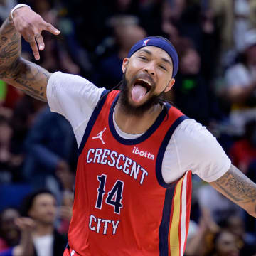 Feb 5, 2024; New Orleans, Louisiana, USA; New Orleans Pelicans forward Brandon Ingram (14) celebrates a three point basket against the Toronto Raptors during the second half at Smoothie King Center.