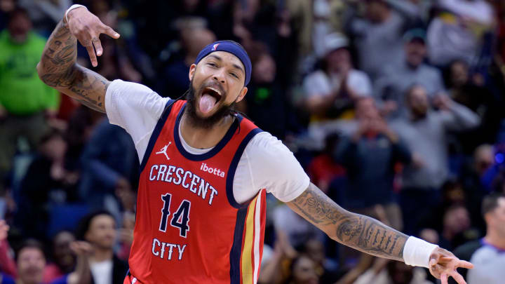 Feb 5, 2024; New Orleans, Louisiana, USA; New Orleans Pelicans forward Brandon Ingram (14) celebrates a three point basket against the Toronto Raptors during the second half at Smoothie King Center.