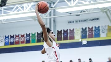 Newport's Taylen Kinney (0) goes up for two of his 13 points in the first half against Washington County at Wednesday's 2023 King of the Bluegrass basketball tournament at Fairdale High School. Dec. 20, 2023
