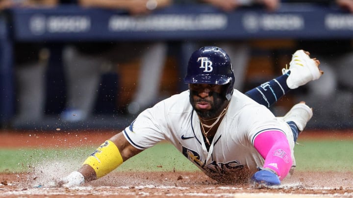 Jul 11, 2024; St. Petersburg, Florida, USA; Tampa Bay Rays first baseman Yandy Diaz (2) scores a run against the New York Yankees in the third inning  at Tropicana Field. Mandatory Credit: Nathan Ray Seebeck-USA TODAY Sports