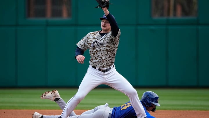 Apr 3, 2024; Columbus, OH, USA; Columbus Clippers first baseman Kyle Manzardo (9) attempts a pick off on Omaha Storm Chasers short stop Cam Devanney (24) during Opening Day at Huntington Park.