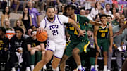 Feb 26, 2024; Fort Worth, Texas, USA; TCU Horned Frogs forward JaKobe Coles (21) works past Baylor Bears guard Ja'Kobe Walter (4) during the first half at Ed and Rae Schollmaier Arena. Mandatory Credit: Raymond Carlin III-Imagn Images