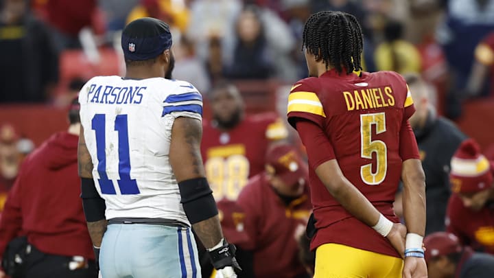 Dallas Cowboys linebacker Micah Parsons talks with Washington Commanders quarterback Jayden Daniels