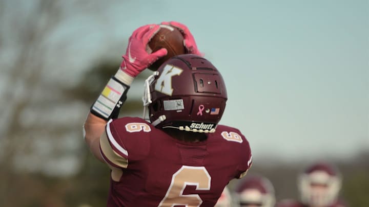 Killingly senior Ben Jax leaps up and makes the catch against Masuk's Tariq Al-Hameedi on Sunday at Morgan Field.

Jax