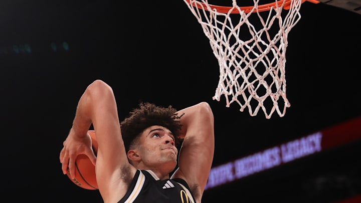Apr 1, 2025; Brooklyn, NY, USA; McDonald's All American East forward Cameron Boozer (12) dunks the ball during the second half of the game at Barclays Center. Mandatory Credit: Pamela Smith-Imagn Images