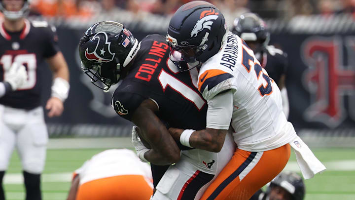 Nov 2, 2025; Houston, Texas, USA; Denver Broncos cornerback Kris Abrams-Draine (31) tackles Houston Texans wide receiver Nico Collins (12) during the first half at NRG Stadium. Mandatory Credit: Thomas Shea-Imagn Images Nov 2, 2025; Houston, Texas, USA; Denver Broncos cornerback Kris Abrams-Draine (31) tackles Houston Texans wide receiver Nico Collins (12) during the first half at NRG Stadium. Mandatory Credit: Thomas Shea-Imagn Images
