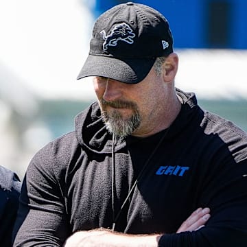 Detroit Lions general manager Brad Holmes, left, talks to head coach Dan Campbell as they walk off the field 