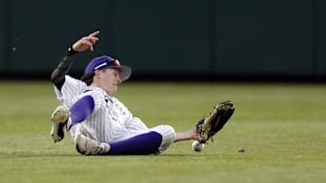 Jun 18, 2018; Omaha, NE, USA; Washington Huskies center fielder Braiden Ward (7) is unable to catch a ball against the Oregon State Beavers in the eighth inning in the College World Series at TD Ameritrade Park. Mandatory Credit: Bruce Thorson-Imagn Images