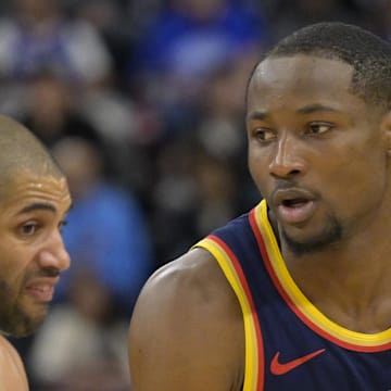 Dec 27, 2024; Inglewood, California, USA; Golden State Warriors forward Jonathan Kuminga (00) drives around Los Angeles Clippers forward Nicolas Batum (33) in the second half at Intuit Dome. Mandatory Credit: Jayne Kamin-Oncea-Imagn Images