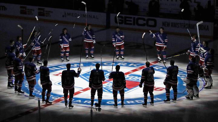 Jan 14, 2021; New York, NY, USA; New York Rangers players huddle around the center ice logo as they prepare for the home opener against the New York Islanders at Madison Square Garden. Mandatory Credit: Bruce Bennett/Pool Photo via USA TODAY Sports Jan 14, 2021; New York, NY, USA; New York Rangers players huddle around the center ice logo as they prepare for the home opener against the New York Islanders at Madison Square Garden. Mandatory Credit: Bruce Bennett/Pool Photo via USA TODAY Sports