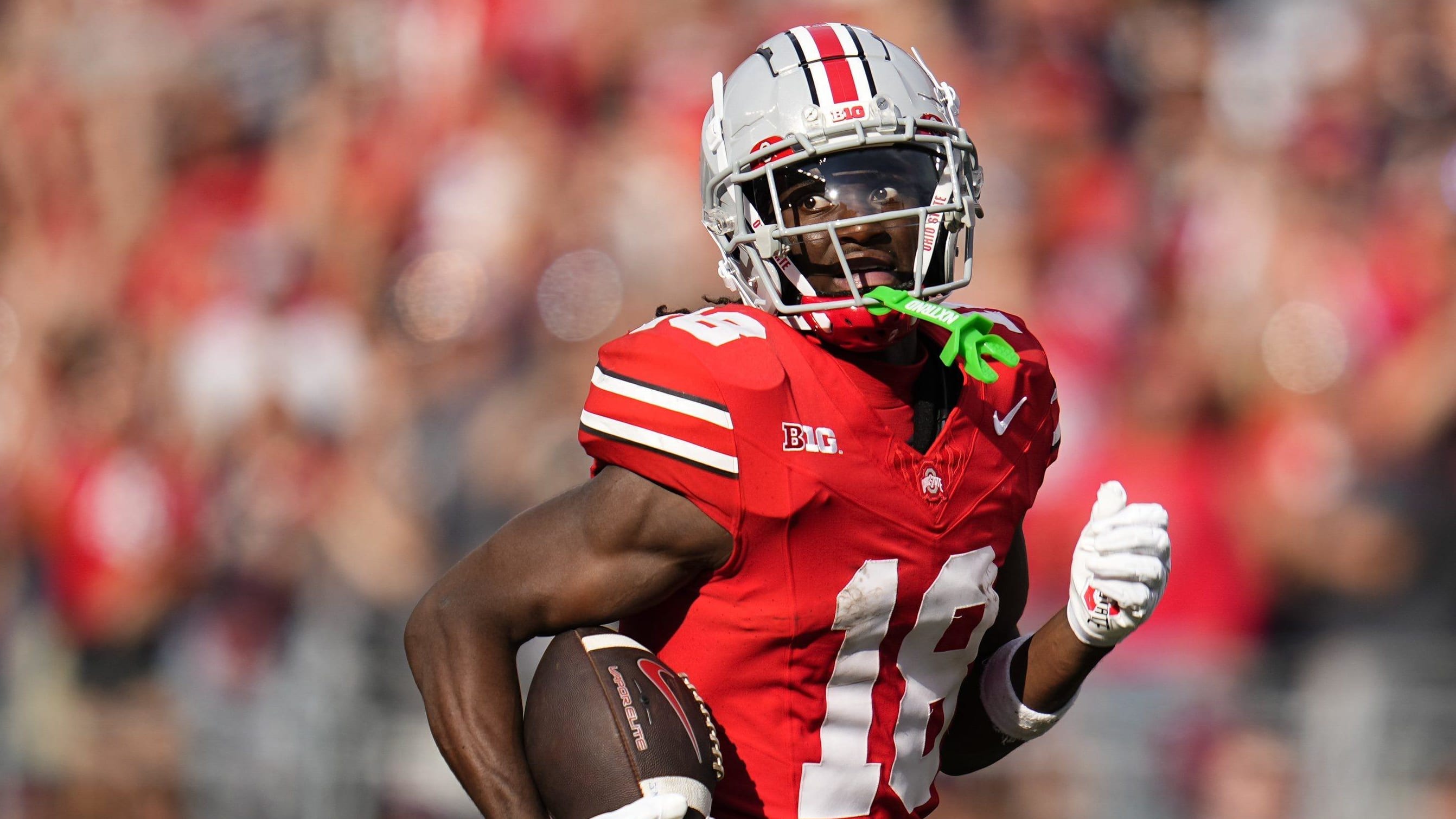 Ohio State wide receiver Marvin Harrison Jr. runs with the football.