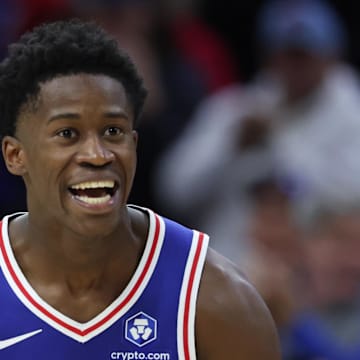 Oct 27, 2025; Philadelphia, Pennsylvania, USA; Philadelphia 76ers guard VJ Edgecombe (77) reacts to guard Tyrese Maxey (0) three pointer against the Orlando Magic during the fourth quarter at Xfinity Mobile Arena. Mandatory Credit: Bill Streicher-Imagn Images