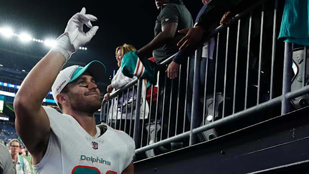 Durham Smythe walks off the field for the Miami Dolphins after beating the New England Patriot
