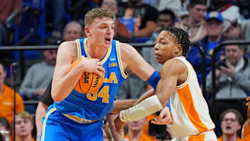 Mar 22, 2025; Lexington, KY, USA; UCLA Bruins forward Tyler Bilodeau (34) drives to the basket against Tennessee Volunteers guard Jordan Gainey (11) during the first half in the second round of the NCAA Tournament at Rupp Arena. Mandatory Credit: Aaron Doster-Imagn Images
