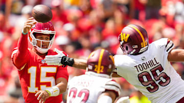 Aug 20, 2022; Kansas City, Missouri, USA; Kansas City Chiefs quarterback Patrick Mahomes (15) throws a pass as Washington Commanders defensive end Casey Toohill (95) and safety Darrick Forrest (22) defend during the first half at GEHA Field at Arrowhead Stadium. Mandatory Credit: Jay Biggerstaff-Imagn Images