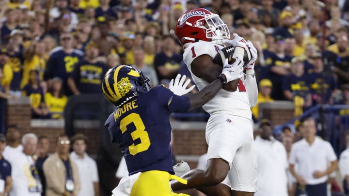 Aug 31, 2024; Ann Arbor, Michigan, USA;  Fresno State Bulldogs defensive back Cam Lockridge (1) intercepts a pass intended for Michigan Wolverines wide receiver Fredrick Moore (3) in the first half at Michigan Stadium. Mandatory Credit: Rick Osentoski-USA TODAY Sports