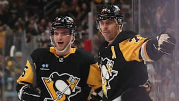 Feb 27, 2025; Pittsburgh, Pennsylvania, USA;  Pittsburgh Penguins defenseman Ryan Shea (5) and center Evgeni Malkin (71) celebrate a goal by Malkin  against  the Philadelphia Flyers during the third period at PPG Paints Arena. Mandatory Credit: Charles LeClaire-Imagn Images