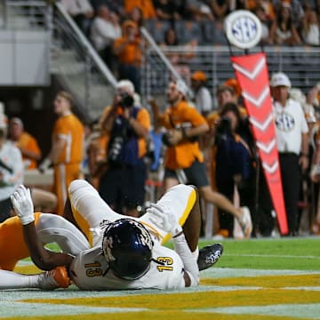 Sep 14, 2024; Knoxville, Tennessee, USA; Tennessee Volunteers wide receiver Mike Matthews (10) catches a touchdown pass against Kent State Golden Flashes safety Tevin Tucker (13) at Neyland Stadium. Mandatory Credit: Randy Sartin-Imagn Images