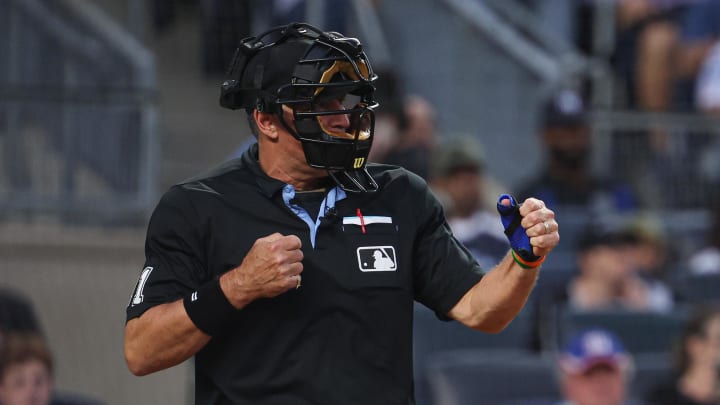 Aug 4, 2023; Bronx, New York, USA; Umpire Tony Randazzo (11) signals a strike out while wearing a video camera on his mask during the first inning between the New York Yankees and the Houston Astrosat Yankee Stadium. Mandatory Credit: Vincent Carchietta-USA TODAY Sports