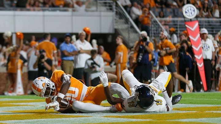 Sep 14, 2024; Knoxville, Tennessee, USA; Tennessee Volunteers wide receiver Mike Matthews (10) catches a touchdown pass against Kent State Golden Flashes safety Tevin Tucker (13) at Neyland Stadium. Mandatory Credit: Randy Sartin-Imagn Images