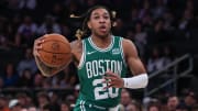 Oct 9, 2023; New York, New York, USA; Boston Celtics guard JD Davison (20) drives to the basket during the first half against the New York Knicks at Madison Square Garden. Mandatory Credit: Vincent Carchietta-USA TODAY Sports