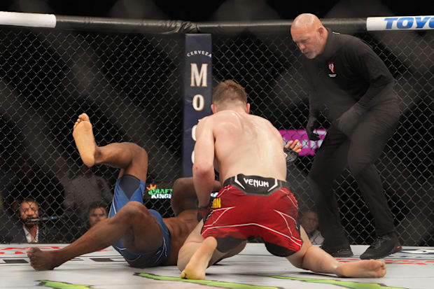 Edmen Shahbazyan (red gloves) fights Dalcha Lungiambula (blue gloves) during UFC 282 at T-Mobile Arena. 
