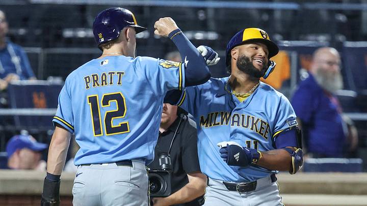 Milwaukee Brewers left fielder Jackson Chourio  celebrates with shortstop Cooper Pratt.