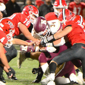 Killingly senior Soren Rief is surrounded New Canaan defenders during the Class L quarterfinals Tuesday at Dunning Field.