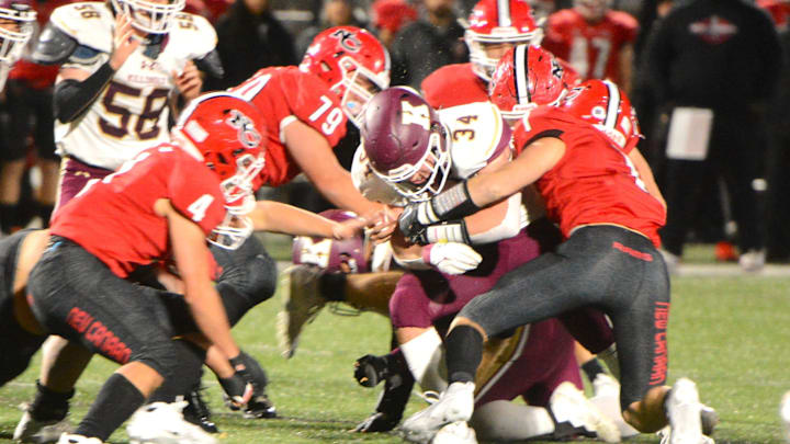 Killingly senior Soren Rief is surrounded New Canaan defenders during the Class L quarterfinals Tuesday at Dunning Field.