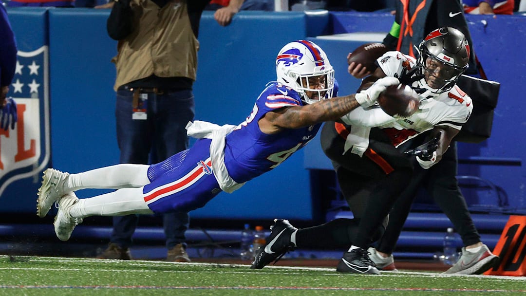 Buffalo Bills cornerback Christian Benford (47) dives to break up this pass intended for Tampa Bay Buccaneers wide receiver Chris Godwin (14).