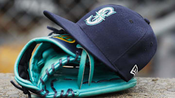 May 12, 2018; Detroit, MI, USA; Hat and glove of Seattle Mariners center fielder Dee Gordon (9) sits in dugout during the third inning against the Detroit Tigers at Comerica Park. 