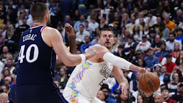 Apr 29, 2025; Denver, Colorado, USA; LA Clippers center Ivica Zubac (40) defends Denver Nuggets center Nikola Jokic (15) in the second half during game five of the first round for the 2025 NBA Playoffs at Ball Arena. Mandatory Credit: Ron Chenoy-Imagn Images