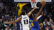 Jan 23, 2025; Denver, Colorado, USA; Sacramento Kings forward Keegan Murray (13) fouls Denver Nuggets forward Peyton Watson (8) in the second half at Ball Arena. Mandatory Credit: Ron Chenoy-Imagn Images