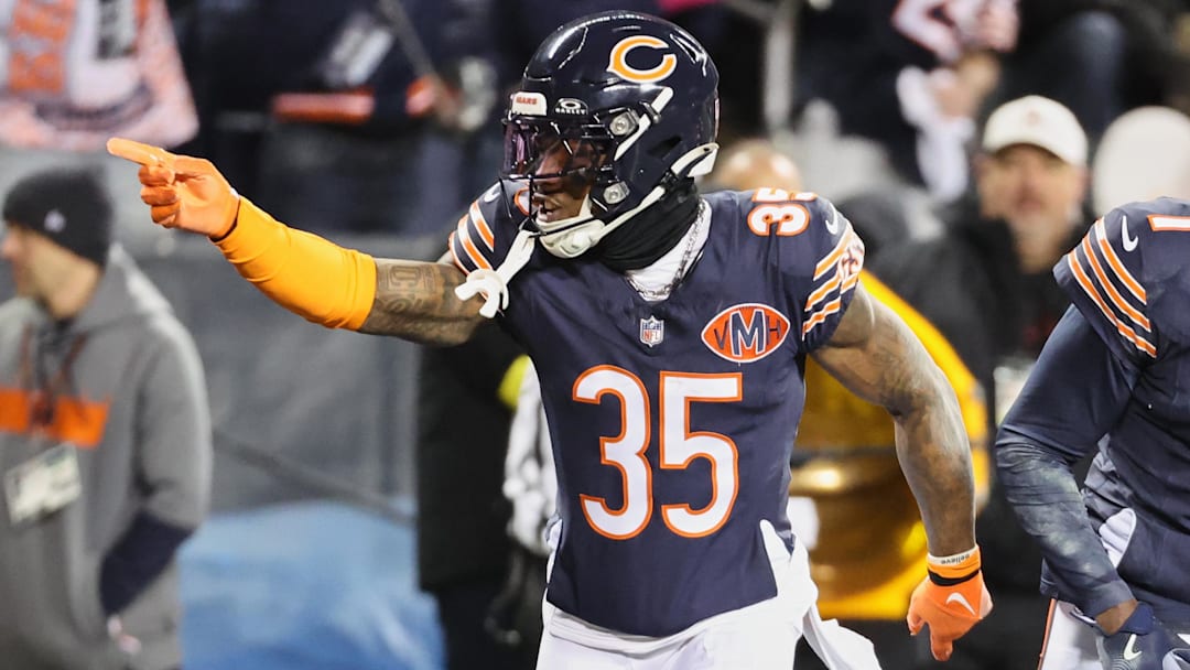 Chicago Bears safety C.J. Gardner-Johnson (35) and cornerback Jaylon Johnson (1) acknowledge the crowd against the Green Bay Packers during the first quarter at Soldier Field.