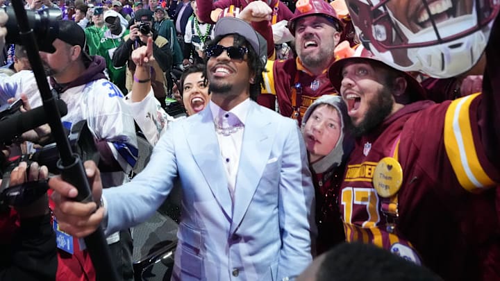 Apr 25, 2024; Detroit, MI, USA; LSU Tigers quarterback Jayden Daniels poses with fans after being selected by the Washington Commanders as the No. 2 pick in the first round of the 2024 NFL Draft at Campus Martius Park and Hart Plaza. Mandatory Credit: Kirby Lee-Imagn Images