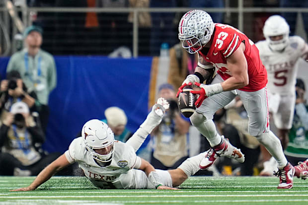 Ohio State Buckeyes defensive end Jack Sawyer sacks Texas Longhorns quarterback Quinn Ewers 