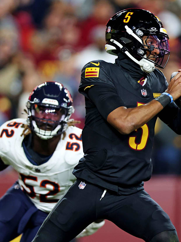 Washington Commanders quarterback Jayden Daniels (5) and Chicago Bears defensive end Darrell Taylor