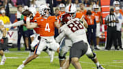 Oct 18, 2025; Charlottesville, Virginia, USA; Virginia Cavaliers quarterback Chandler Morris (4) passes the ball as Washington State Cougars defensive end Isaac Terrell (88) rushes in the third quarter at Scott Stadium. Mandatory Credit: Geoff Burke-Imagn Images