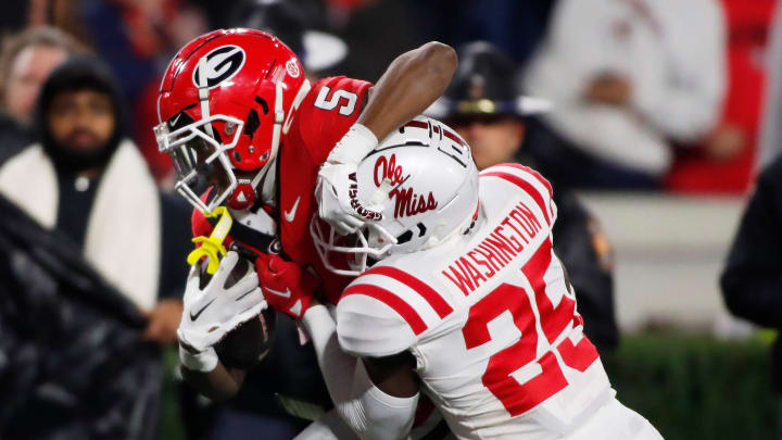 Georgia wide receiver Rara Thomas (5) competes with Ole Miss safety Trey Washington (25) during the first half of a NCAA college football game against Ole Miss in Athens, Ga., on Saturday, Nov. 11, 2023.