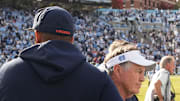 Oct 25, 2025; Chapel Hill, North Carolina, USA; North Carolina Tar Heels head coach Bill Belichick shakes Virginia Cavaliers head coach Tony Elliott hand after the Tar Heels lose to Virginia in overtime at Kenan Stadium. Mandatory Credit: Bob Donnan-Imagn Images