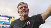 Sep 27, 2025; Morgantown, West Virginia, USA; Utah Utes head coach Kyle Whittingham celebrates with fans after defeating the West Virginia Mountaineers at Milan Puskar Stadium.