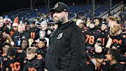 Massillon football coach NateMoore watches with his team as the OHSAA announces Massillon as the 2023 Division II state champions