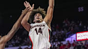 Nov 4, 2024; Athens, Georgia, USA; Georgia Bulldogs forward Asa Newell (14) shoots over Tennessee Tech Golden Eagles forward Ola Ajiboye (8) at Stegeman Coliseum. Mandatory Credit: Dale Zanine-Imagn Images