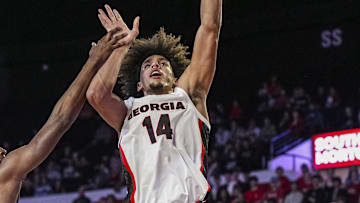Nov 4, 2024; Athens, Georgia, USA; Georgia Bulldogs forward Asa Newell (14) shoots over Tennessee Tech Golden Eagles forward Ola Ajiboye (8) at Stegeman Coliseum. Mandatory Credit: Dale Zanine-Imagn Images