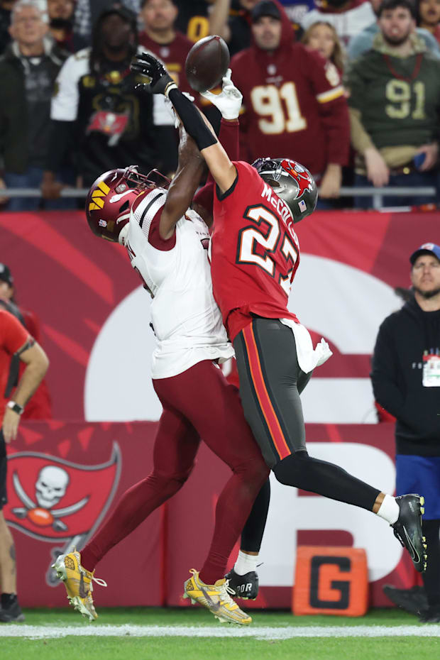 Tampa Bay Buccaneers cornerback Zyon McCollum breaks up a pass for Washington Commanders wide receiver Terry McLaurin