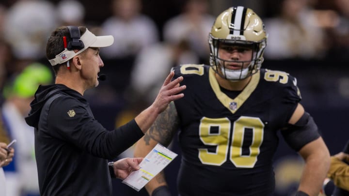 Nov 5, 2023; New Orleans, Louisiana, USA;  New Orleans Saints head coach Dennis Allen talks to defensive tackle Bryan Bresee (90) against the Chicago Bears during the first half at the Caesars Superdome. Mandatory Credit: Stephen Lew-USA TODAY Sports