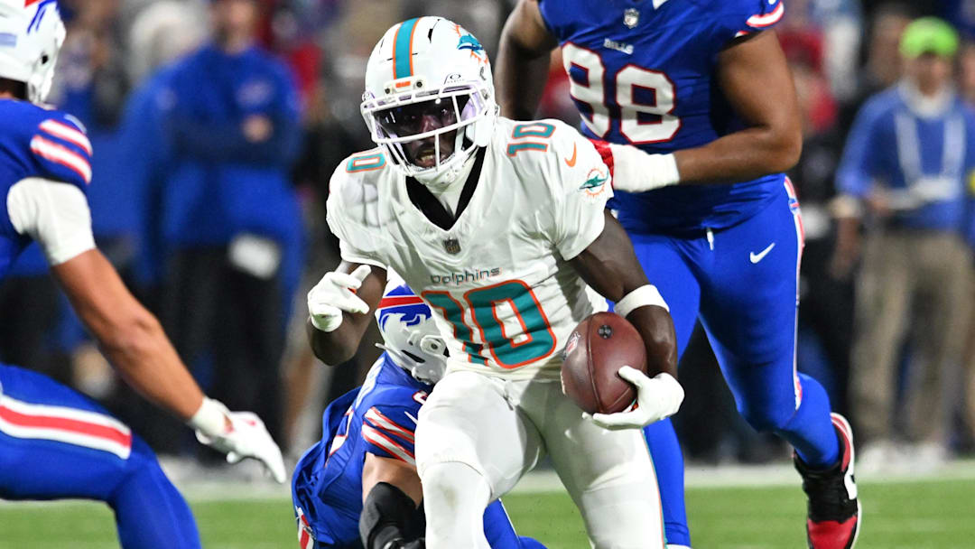 Sep 18, 2025; Orchard Park, New York, USA; Miami Dolphins wide receiver Tyreek Hill (10) runs against Buffalo Bills linebacker Terrel Bernard (8) and safety Cole Bishop (24) in the second quarter at Highmark Stadium. Mandatory Credit: Mark Konezny-Imagn Images Sep 18, 2025; Orchard Park, New York, USA; Miami Dolphins wide receiver Tyreek Hill (10) runs against Buffalo Bills linebacker Terrel Bernard (8) and safety Cole Bishop (24) in the second quarter at Highmark Stadium. Mandatory Credit: Mark Konezny-Imagn Images